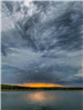 Clouds over Skiatook Lake while the sunsets.
