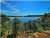 Wide view of Skiatook Lake through the trees.